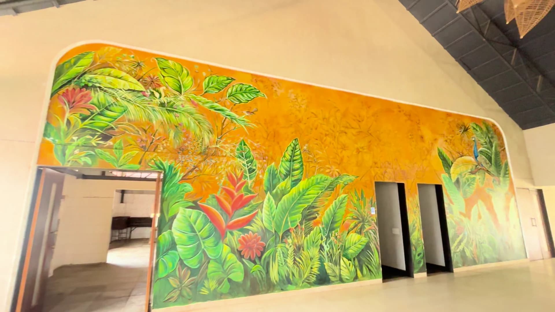 The botanical mural at Maya Dining Deck — property footage, September 2026