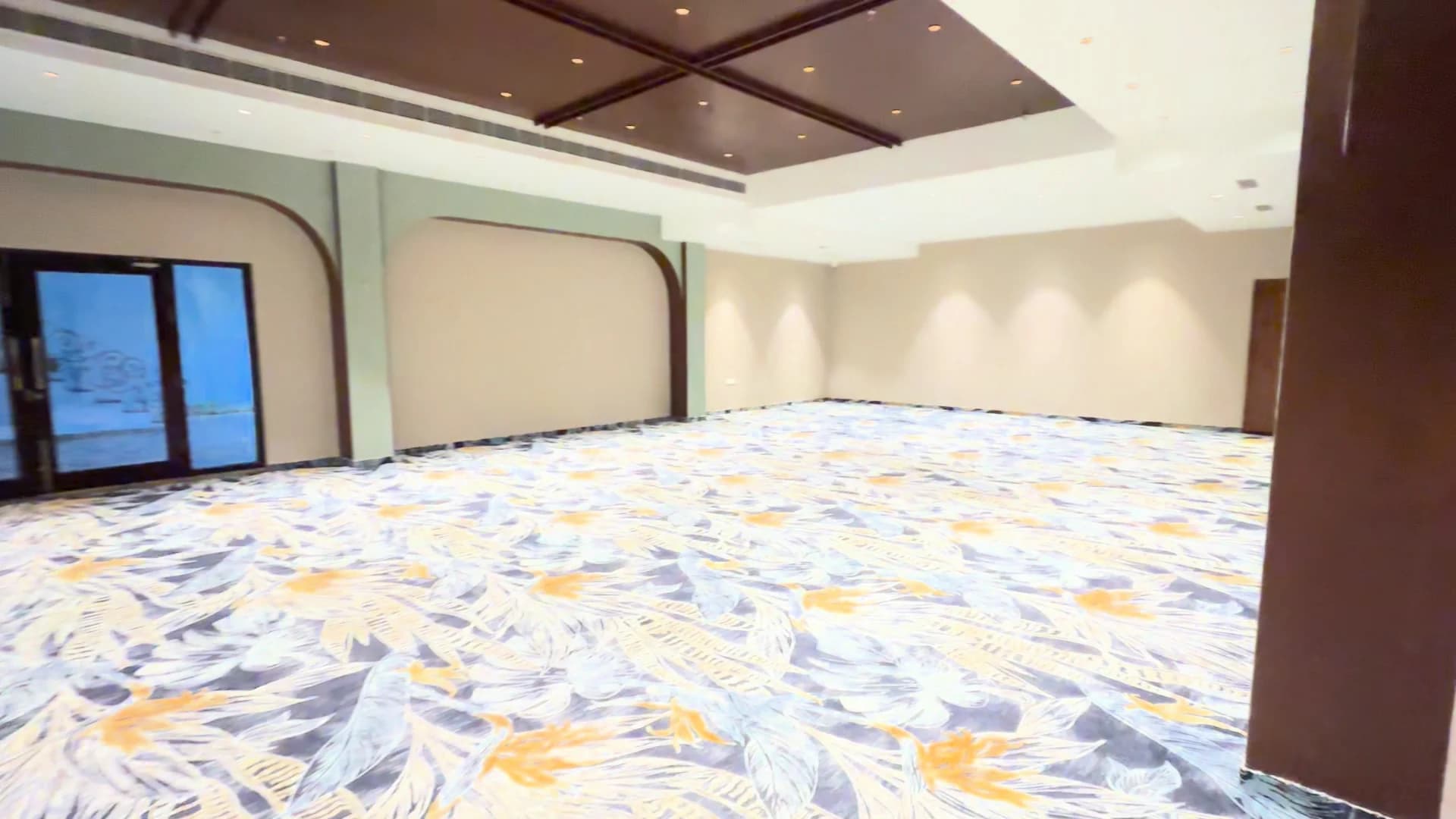 Savaya’s botanical carpet and timber ceiling — property footage, September 2026