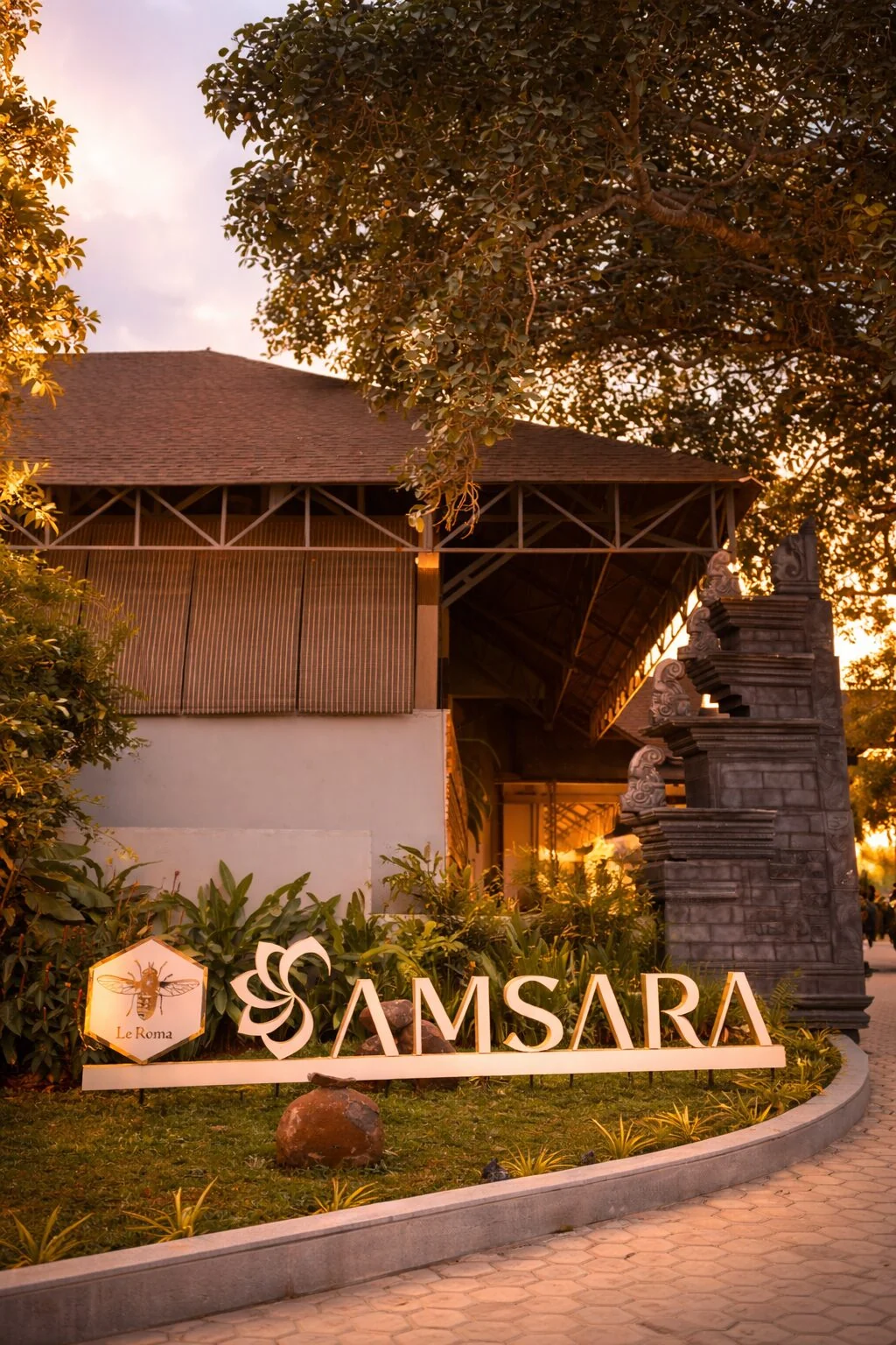 Samsara entrance signage beneath a tree at sunset
