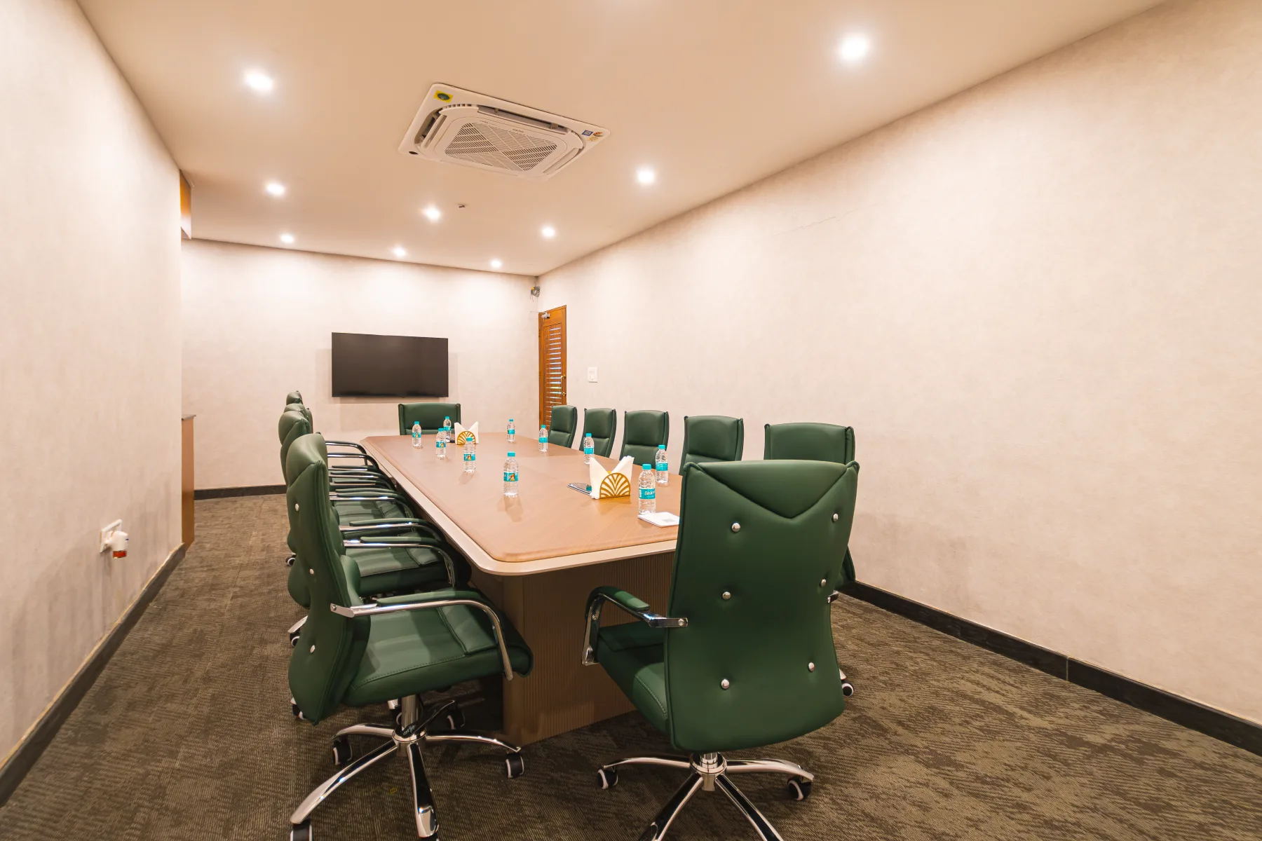 Le Roma Samsara boardroom with executive meeting table and presentation screen