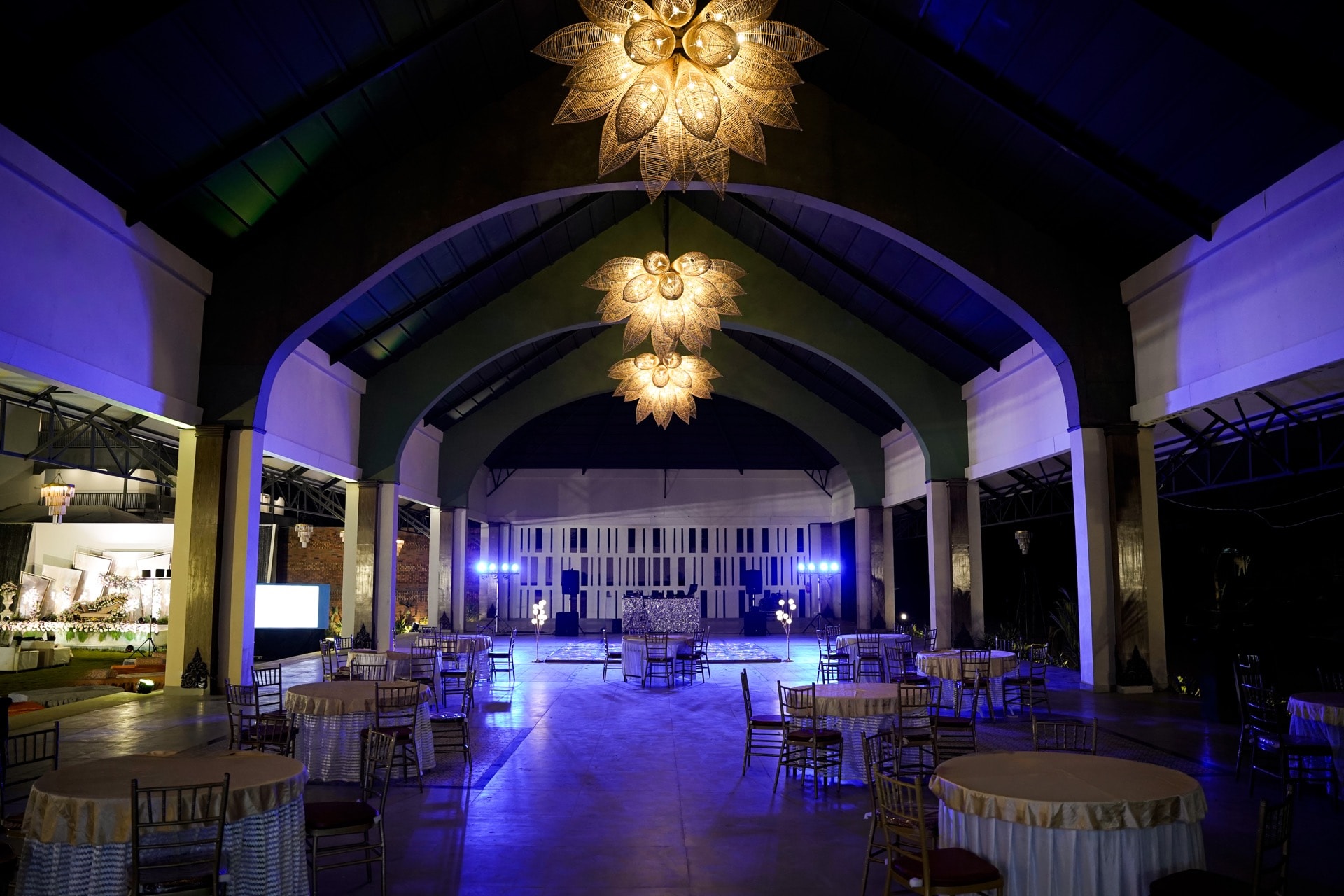 Padma Pavilion — interior with blue uplighting and lotus chandeliers