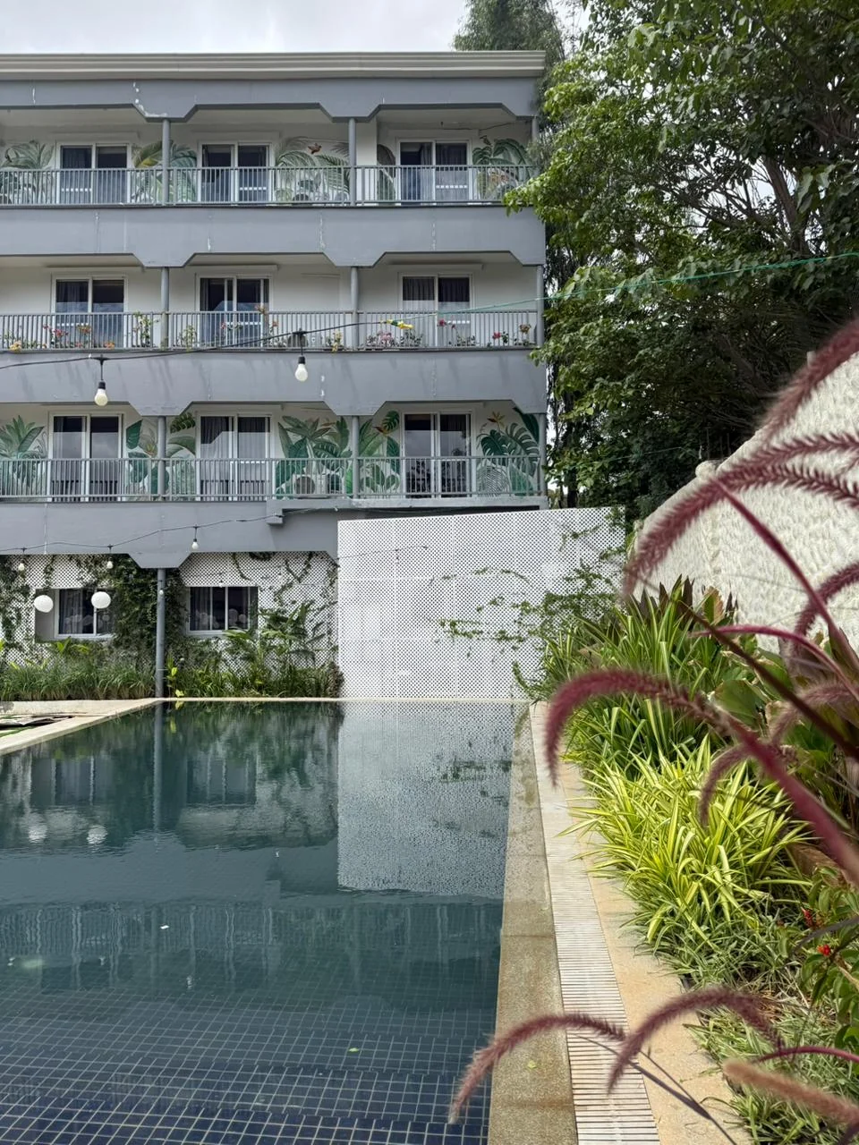 The swimming pool with Rumah Residences at the far end